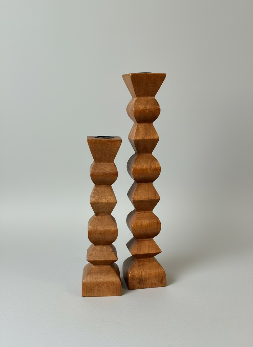 Wooden candle holder on a surface with a window in the background